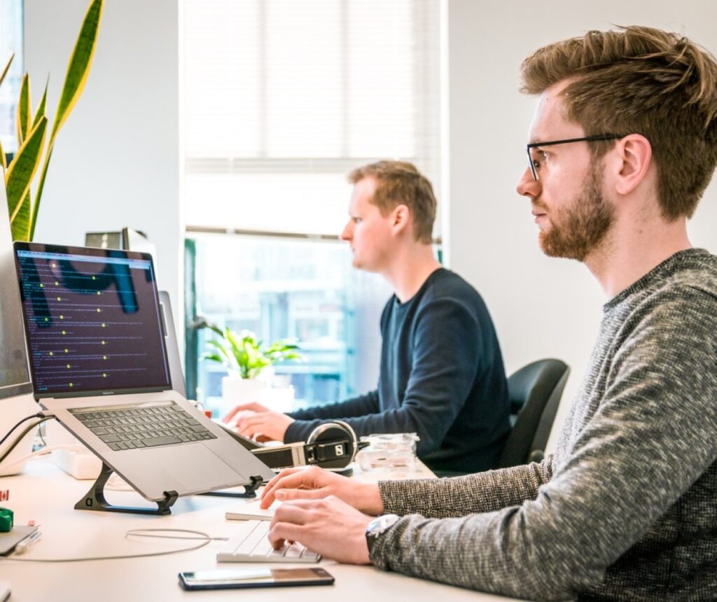 front page image man sitting at computer